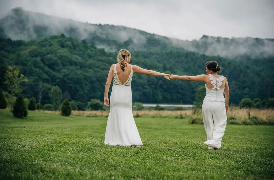 wedding couple in the meadows | wedding venues in Asheville nc